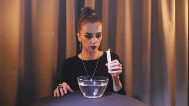 Girl conducts occult retouals — Stock Video