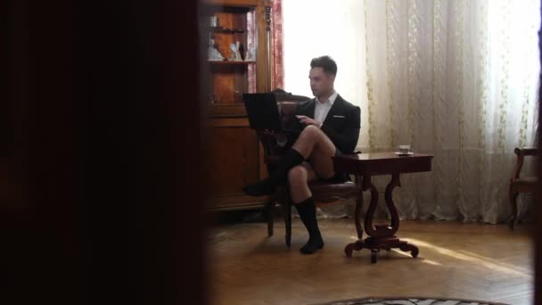 Businessman working at home without pants — Stock Video