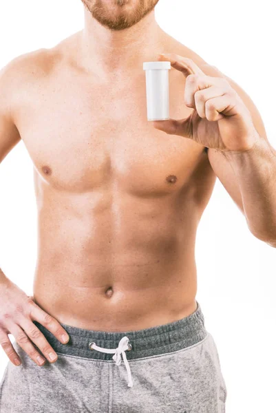 Muskuløs ung mann som holder et tablettglass isolert – stockfoto