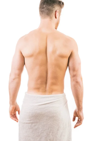Vista trasera de un joven musculoso con una toalla —  Fotos de Stock