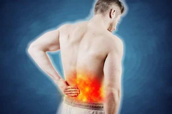 Concept picture of a man with lower back pain — Stock Image Concept picture of a man with lower back pain Royalty Free Stock Images