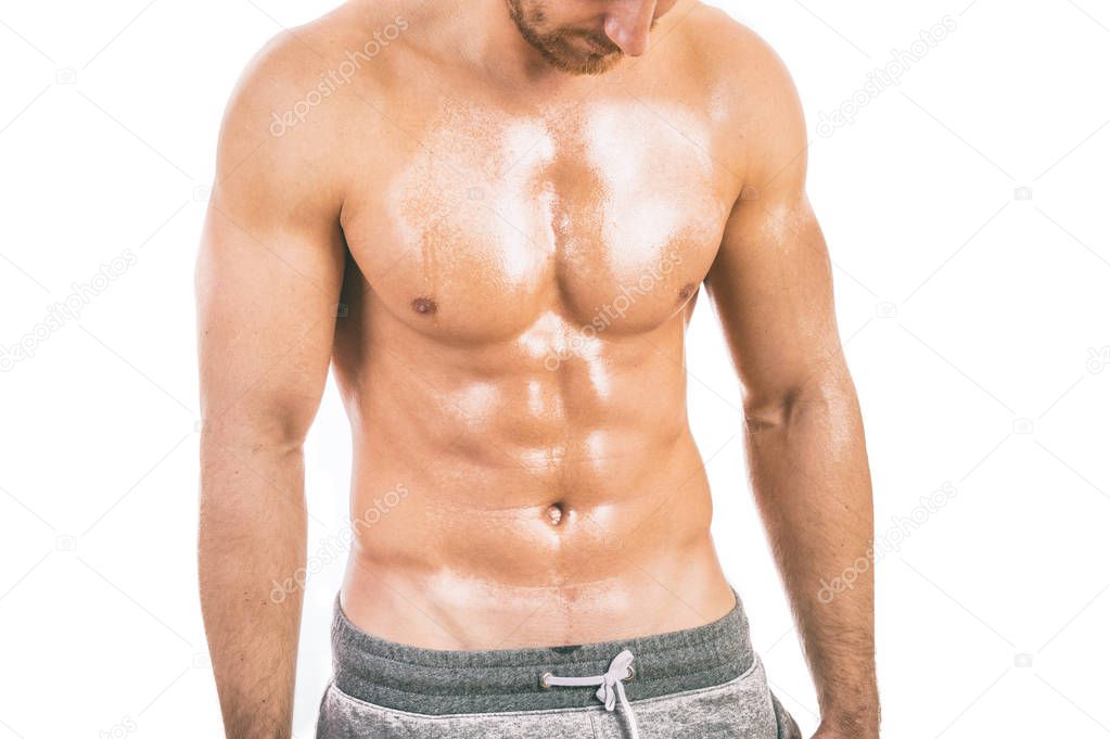 Muscular young man isolated on white background.