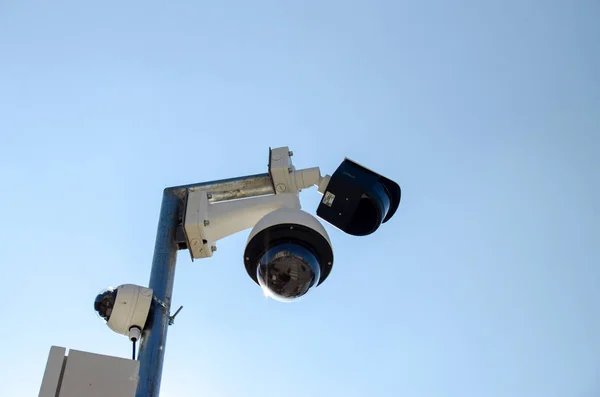 Professional security cameras scanning the street in the city