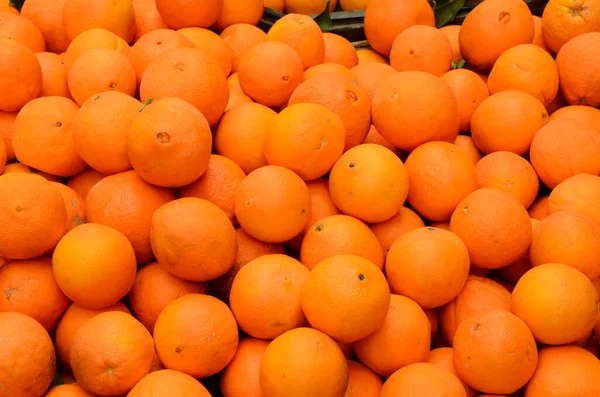 Organic and fresh oranges on fruit market, closeup view