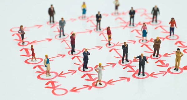 Side view of miniature - social distancing, anti-social, interconnection or team work concept.