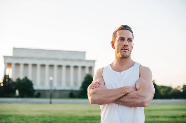 Handsome Caucasian man portrait while resting during a workout outdoors at the National Mall in Washington DC