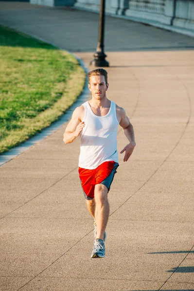 Caucasian Man Jogging Outdoors Early Morning — 스톡 사진