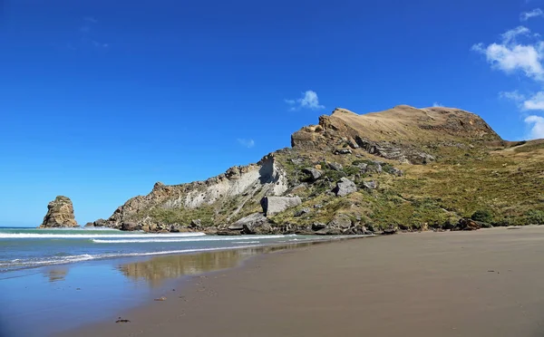 Castle Rock on blue sky - Castlepoint, New Zealand