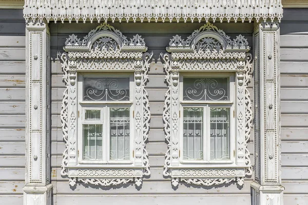 Facade of a Russian wooden house with platbands — Stock Photo, Image