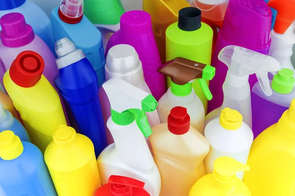 background of multi-colored bottles with household chemicals