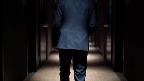 Man Blue Business Suit Walking Corridor Hotel Shooting Back Dim — Stock Video