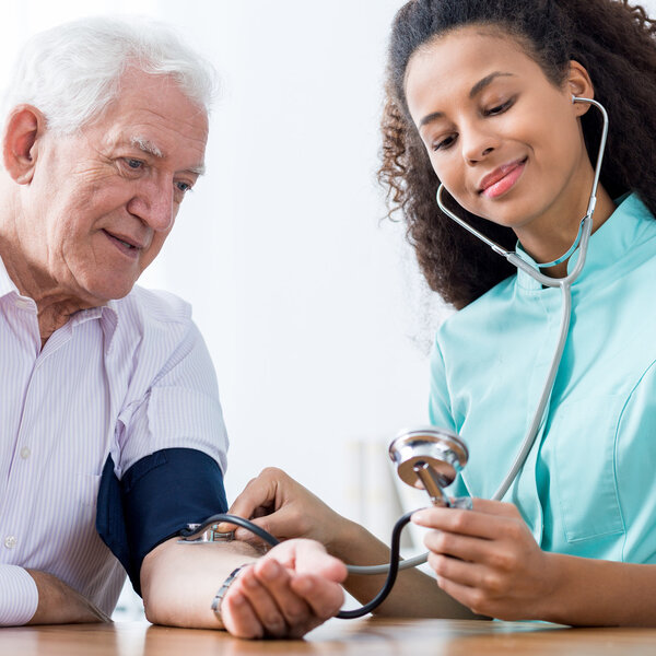 Nurse taking blood pressure