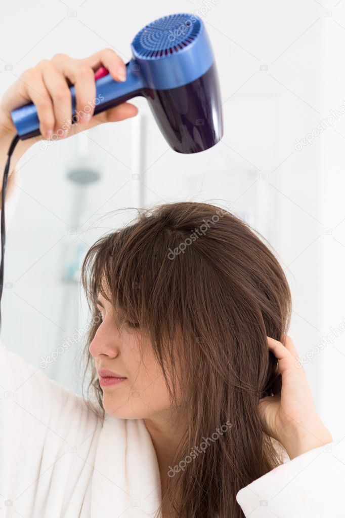 Trying her new hairdryer