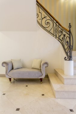 Elegant sofa in a hall clipart