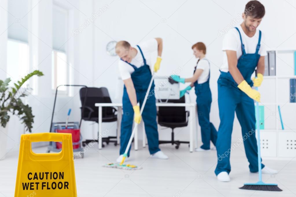 Cleaners mopping floor