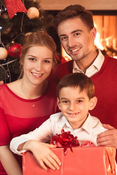 Parents and child with present — Stock Photo, Image