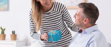 Woman giving the present to her disabled husband clipart
