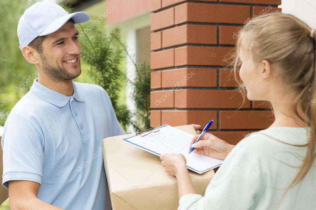 Smiling courier with a parcel 