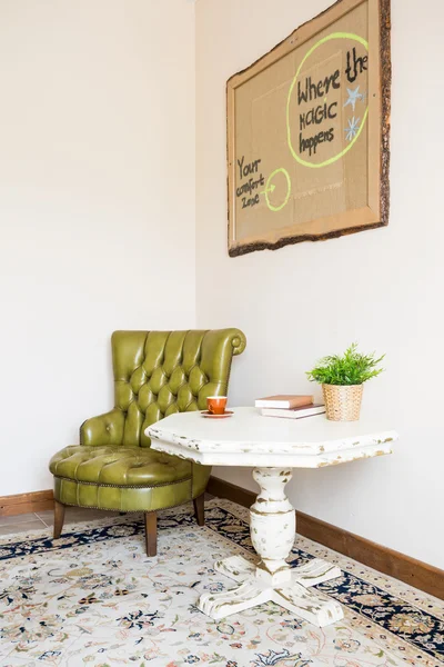 Green leather armchair and table — Stock Photo, Image