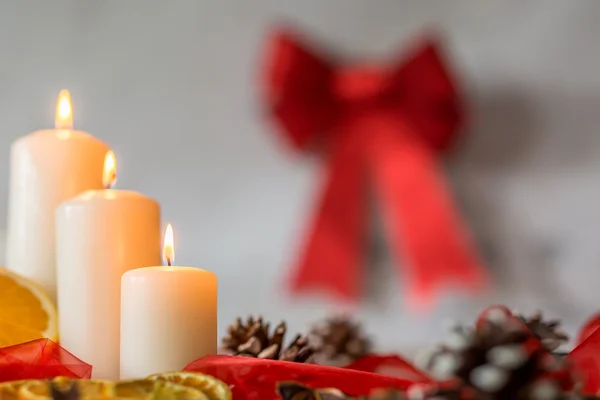 White candles and red ribbon — Stock Photo, Image