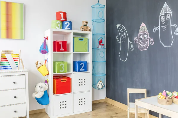 Child room with cabinet table — Stock Photo, Image