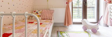 Cosy girl's bedroom with balcony clipart