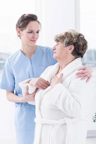 Senior woman and her nurse — Stock Photo, Image