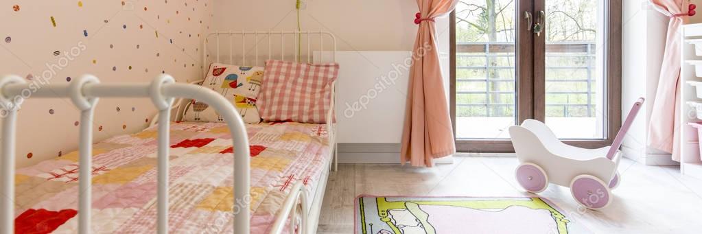 Cosy girl's bedroom with balcony
