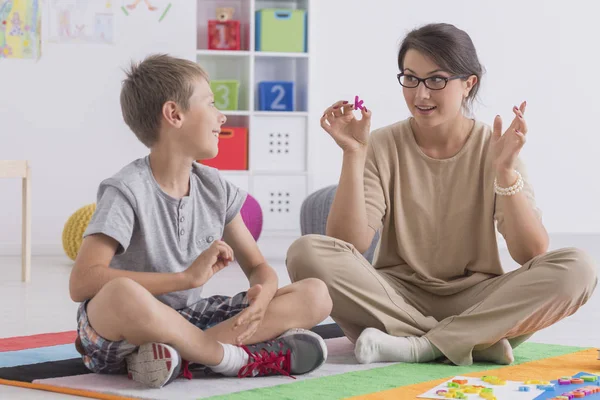 Professional babysitter with a school-boy — Stock Photo, Image