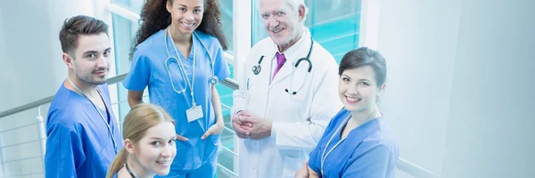 Smiling doctors in hospital — Stock Photo, Image