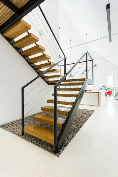 Wooden staircase in white kitchen — Stock Photo, Image