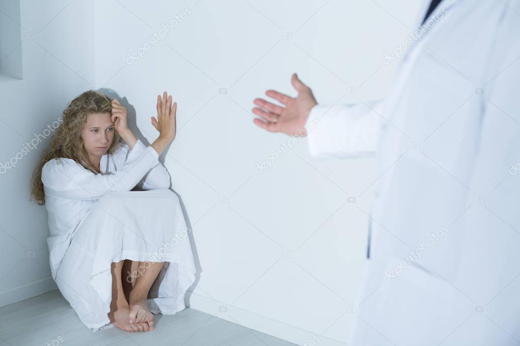 Doctor extending his hand to patient 
