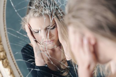 Girl reflected in broken mirror clipart