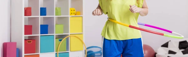 Close-up of girl with hula hoop — Stock Photo, Image