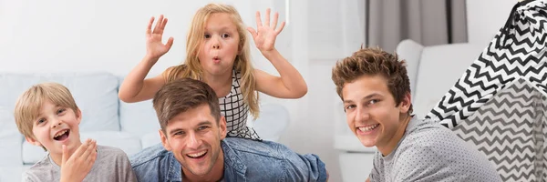 Girl clowning with her brothers — Stock Photo, Image