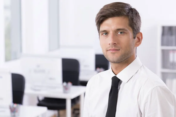 Man in white shirt and tie in office — Stock Photo, Image