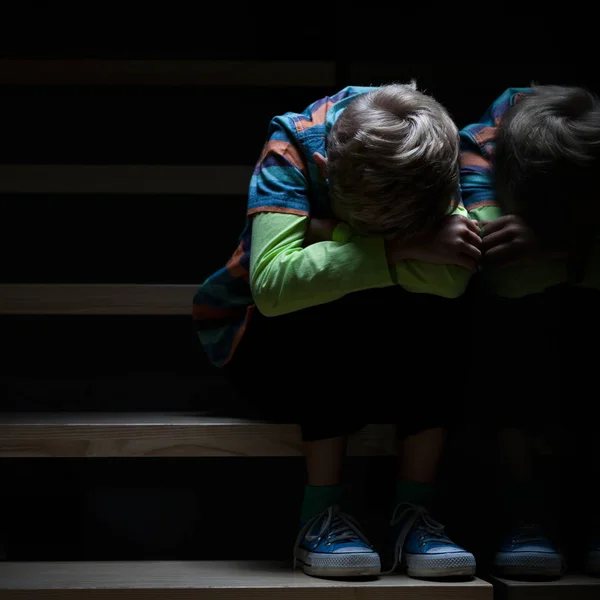 Alone boy hugging his knees — Stock Photo, Image