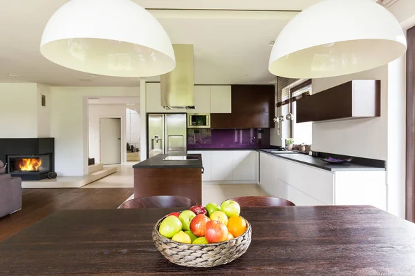 Dark wooden table in stylish house — Stock Photo, Image