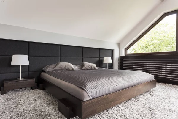 Elegant bed in dark frame