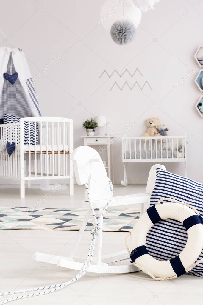 Room with rocking horse and cradle