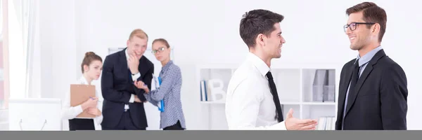 Two guys in suits talking — Stock Photo, Image