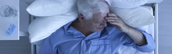 Elderly man with painful headache — Stock Photo, Image