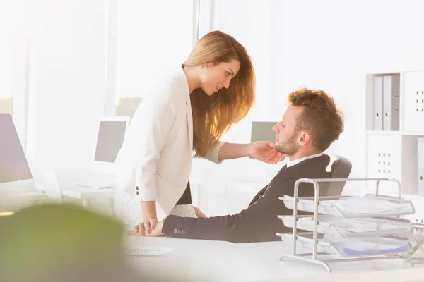 Romantic couple in the office — Stock Photo, Image