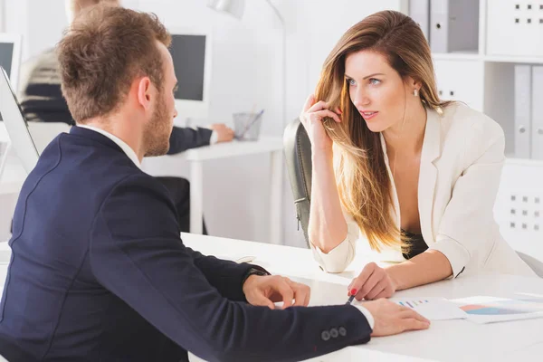 Businesswoman looking seductively at colleague — Stock Photo, Image