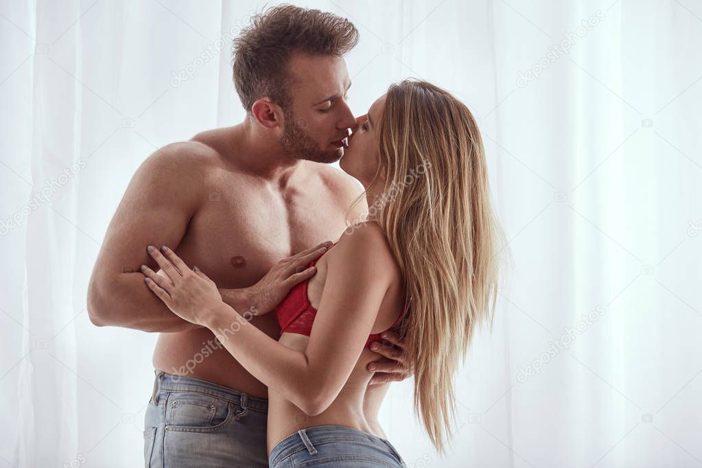Sexy man and woman kissing