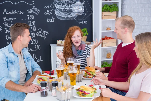 Friends eating hamburgers