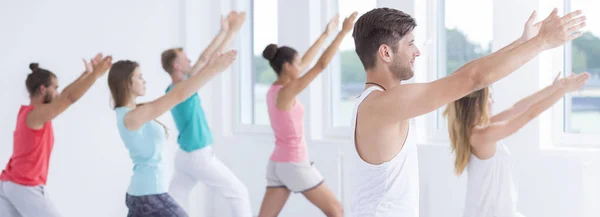 Relaxed people practicing yoga — Stock Photo, Image