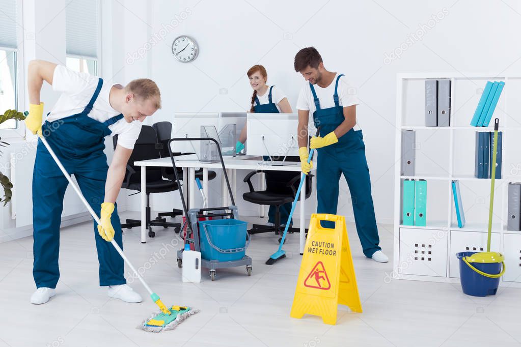 Cleaners cleaning an office