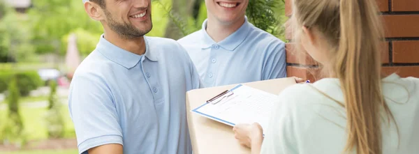 Women with parcel from couriers — Stock Photo, Image