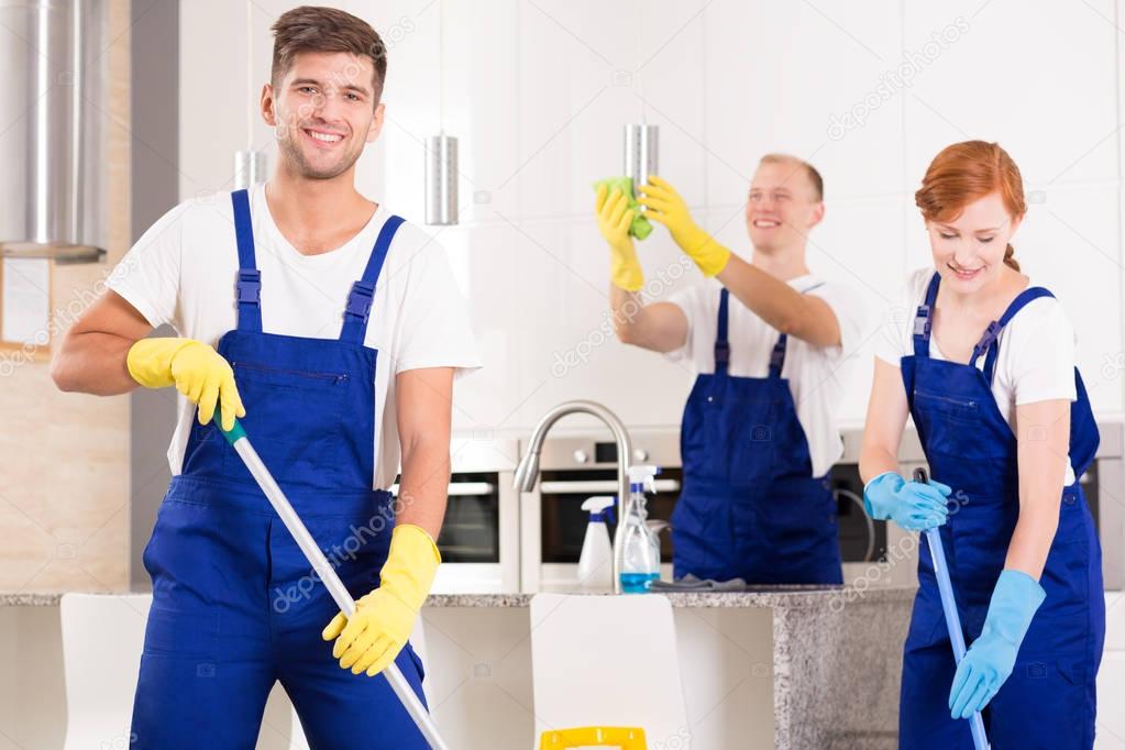 Handsome cleaner with friends